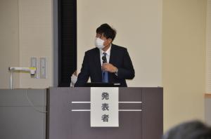 画像：未来創造まちおこし実行委員会による報告の様子